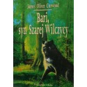 Ilustracja przedstawiająca wilka lub psa na tle zielonego lasu – okładka książki "Bari, syn Szarej Wilczycy".